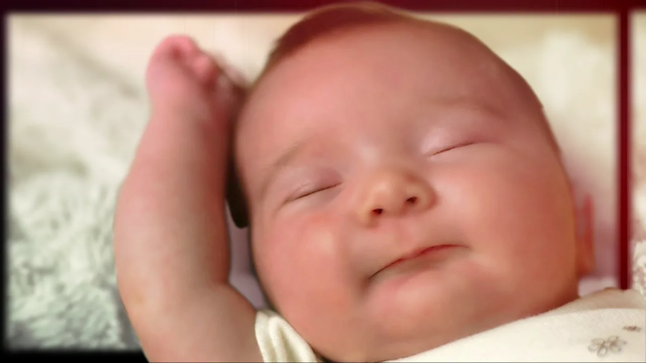 A smiling baby in an edited first-year family film