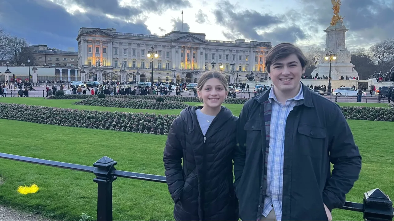 A brother and sister together during a family trip